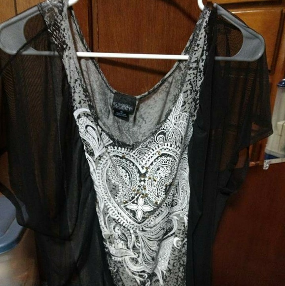 Daytrip Tops - Ladies Daytrip sheer top with embellishments. Daytrip Tops - Ladies Daytrip sheer top with embellishments.